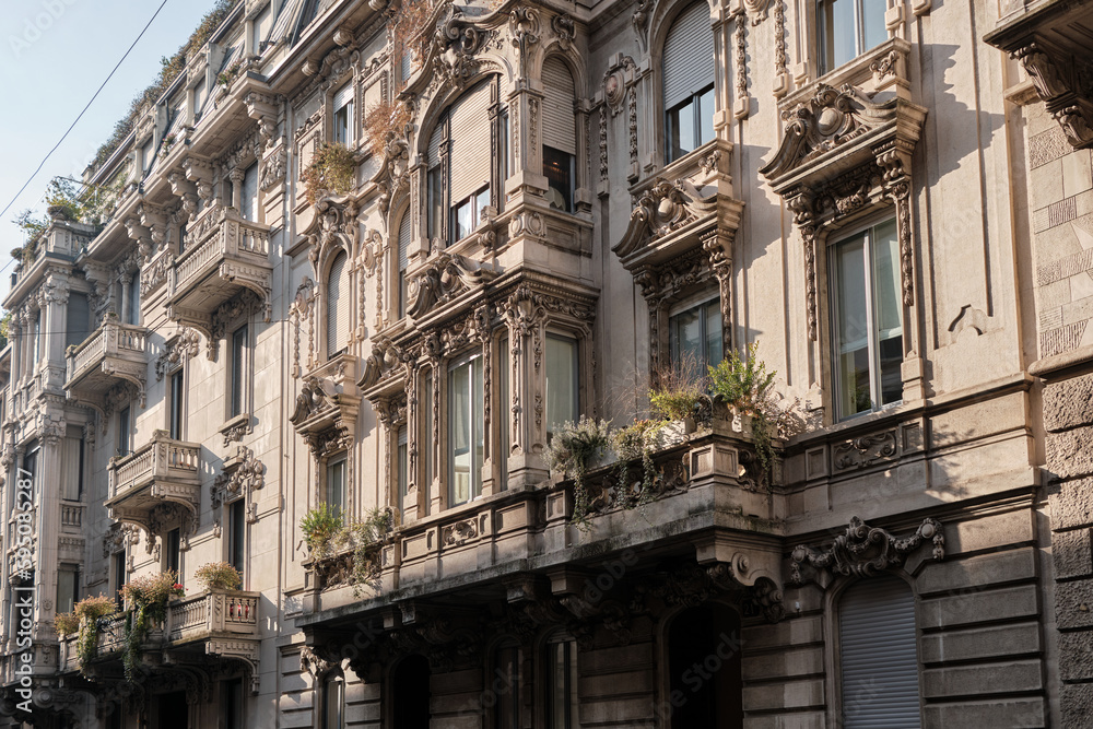 classic facade of stately building in milan in residential district