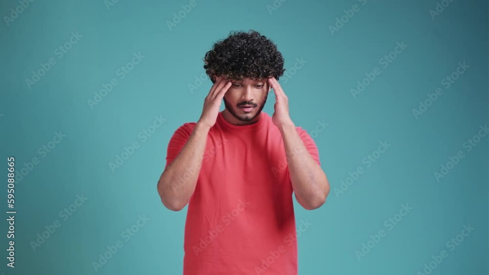 I don't know, who cares. Portrait of confused clueless brunette latin spanish man shrugging shoulders, making no idea gesture, whatever. isolated on a blue studio background I don't know, who cares. Portrait of confused clueless brunette latin spanish man shrugging shoulders, making no idea gesture, whatever. isolated on a blue studio background