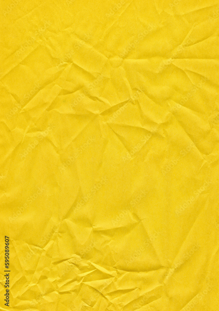 Yellow sheet of paper with small wrinkles on the surface Yellow sheet of paper with small wrinkles on the surface
