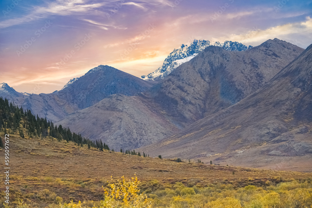 Canada, Yukon, view of the tundra in autumn, with mountains in background, beautiful landscape in a wild country

