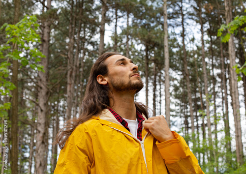 Long hair man in forest © Milos