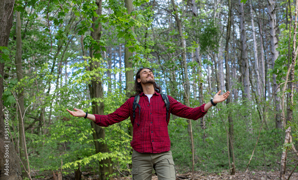 Long hair man in forest