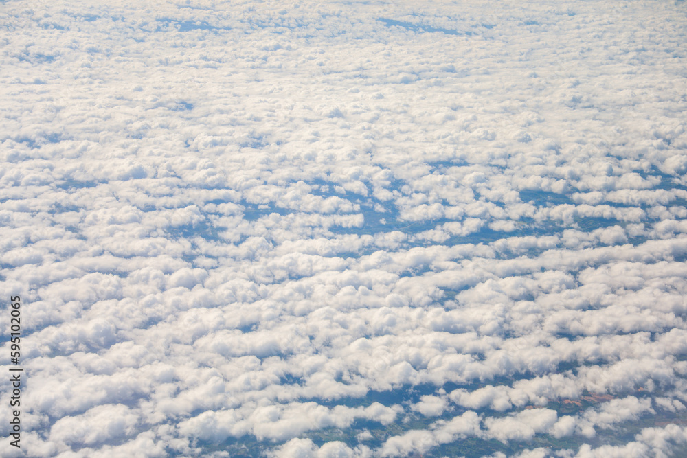 An airplane view of clouds symbolizes freedom, imagination, and perspective. The vast expanse of the sky inspires awe and wonder, offering a sense of detachment from the daily grind An airplane view of clouds symbolizes freedom, imagination, and perspective. The vast expanse of the sky inspires awe and wonder, offering a sense of detachment from the daily grind