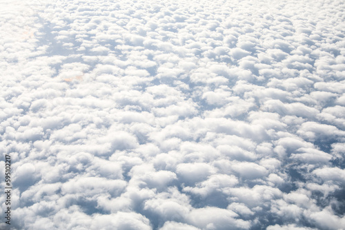 An airplane view of clouds symbolizes freedom  imagination  and perspective. The vast expanse of the sky inspires awe and wonder  offering a sense of detachment from the daily grind 
