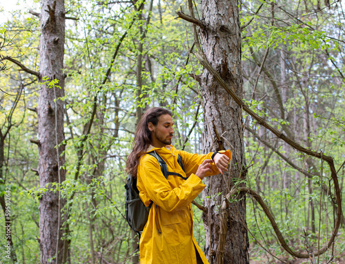 Long hair man in forest photo