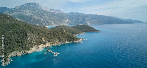 Fototapeta Naklejka Na Ścianę i Meble -  A stunning aerial view of Oludeniz surroundings in Turkey, with sparkling blue sea and tranquil landscape; a peaceful reminder of nature's beauty.