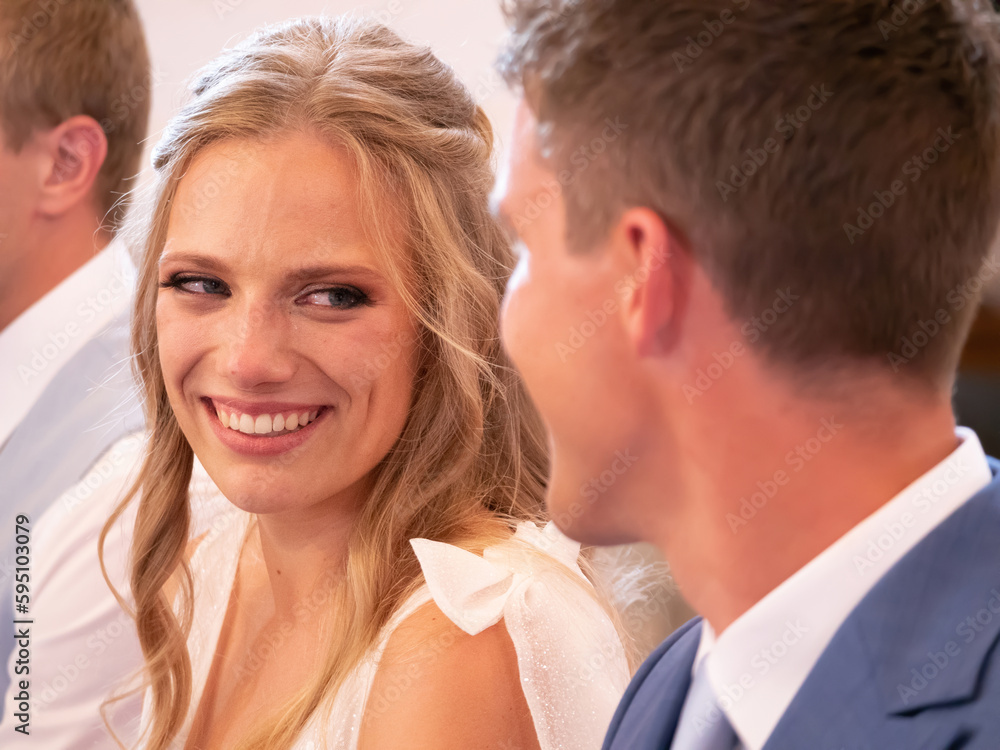 CLOSE UP, PORTRAIT: Beautiful bride smiling to her groom at wedding ceremony CLOSE UP, PORTRAIT: Beautiful bride smiling to her groom at wedding ceremony
