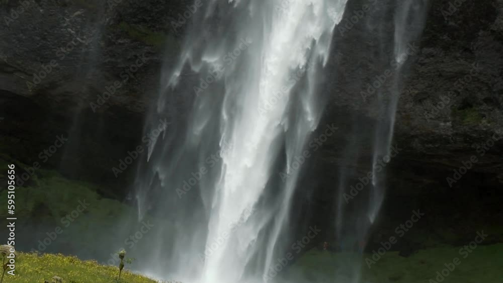 Skógafoss Waterfall close-up view slow motion texture making by water