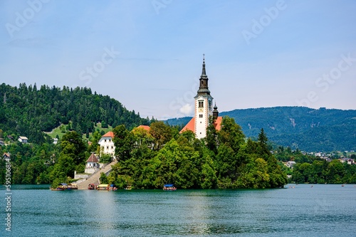 Beautiful idyllic view on island, castle, catholic Maria church in lake Bled. Slovenia