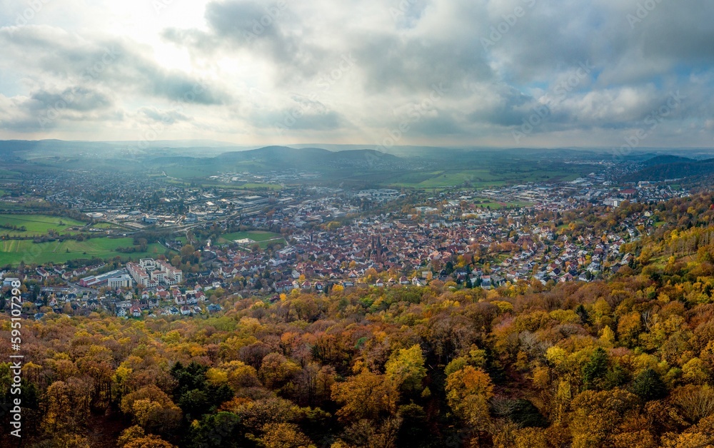 Aerial panorama on town Gelnhausen, Marienkirche chuch, cloudy sky, yellow trees. Hesse, Hessen, Germany