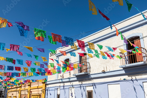 Todos Santos, Baja California Sur, Mexico. Festive colorful banners over a street.
