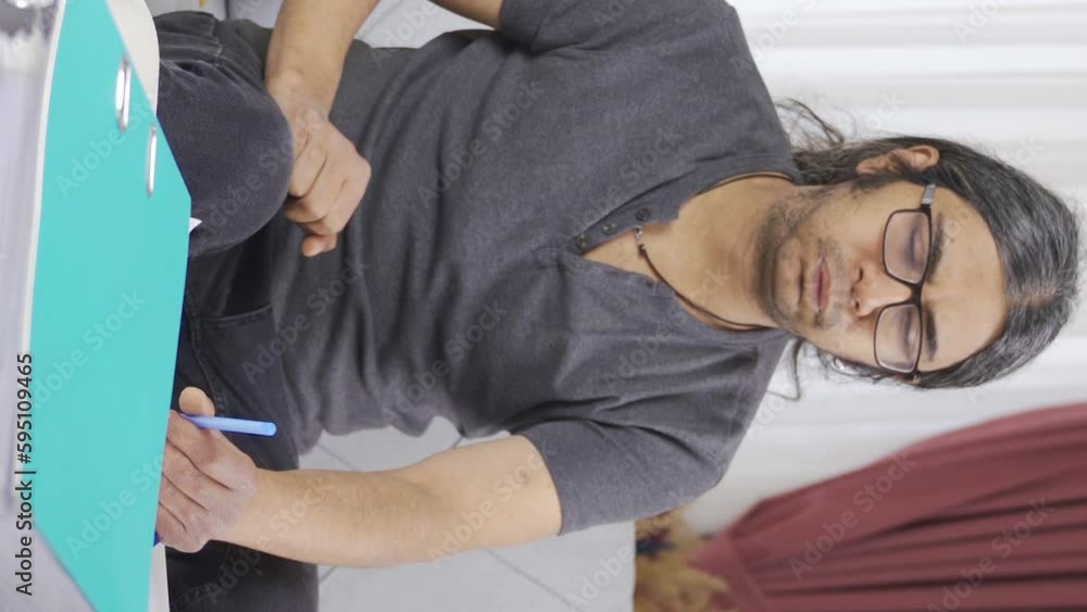 Vertical Video of Lazy man with distraction.
Man working at home is distracted and quits work and picks up phone.
Vertical Video of Lazy man with distraction.
Man working at home is distracted and quits work and picks up phone.