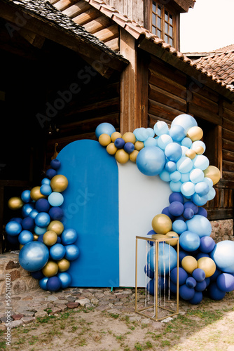 Photozone for a holiday from blue, blue and gold balloons, aerodesign photo