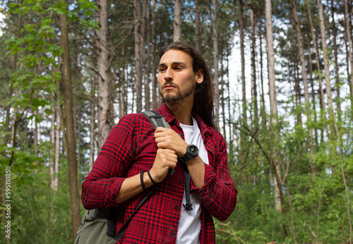 Log hair man in forest photo