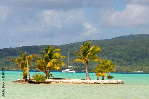 French Polynesia, Taha'a. Small island and sailboat.