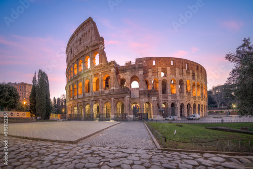 Print op canvas Rome, Italy at the ancient Roman Colosseum Amphitheater at night.