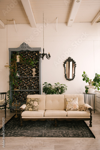 Obraz na płótnie Classic interior, with wooden sofa, vintage sideboard, mirror and flowers w salonie