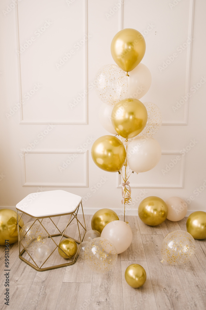 Composition of helium balloons white,, transparent with confetti, as well and a large figure of one golden colors. Gift for 1 years