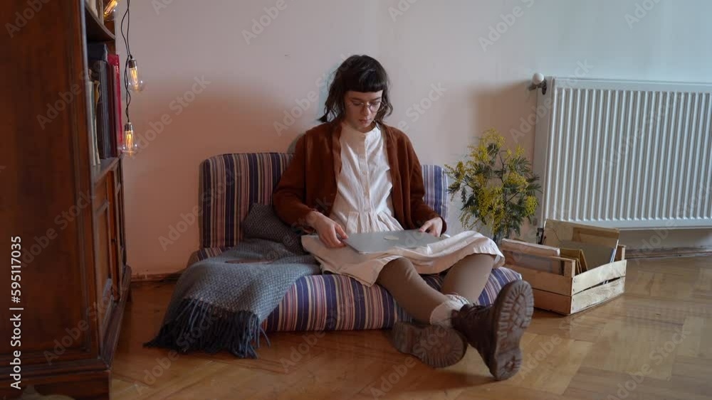 Tired millennial hipster girl taking off glasses closing laptop while sitting on floor at home, freelancer finished work, exhausted student taking break from online study. Overwhelming freelancing Tired millennial hipster girl taking off glasses closing laptop while sitting on floor at home, freelancer finished work, exhausted student taking break from online study. Overwhelming freelancing