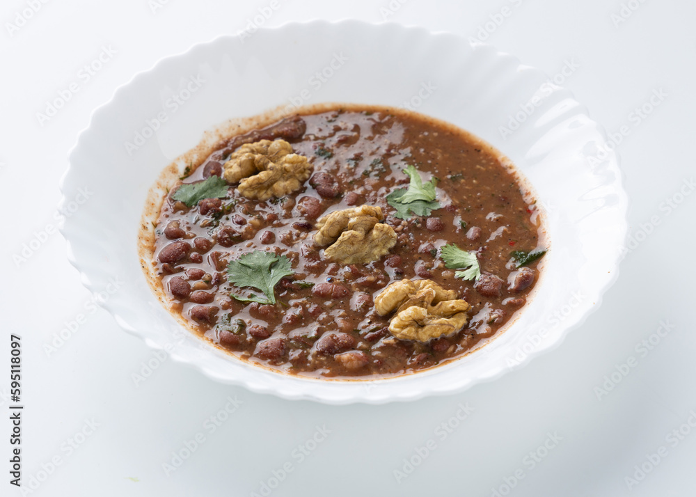 lobio soup in a white plate on a white background lobio soup in a white plate on a white background
