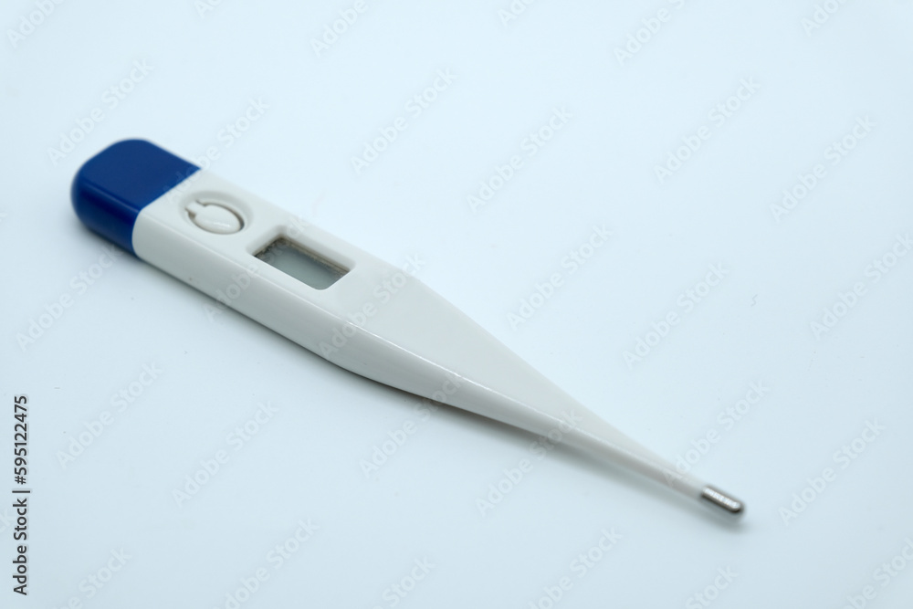 A thermometer with a digital display on a white background A thermometer with a digital display on a white background