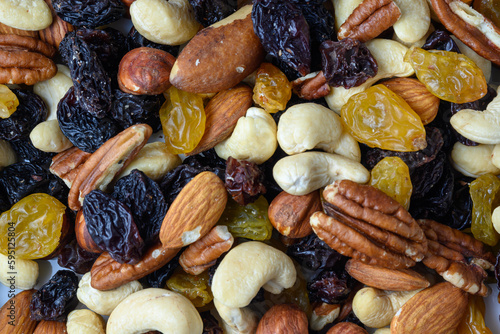 set of nuts and oriental sweets and raisins as a background © ikura