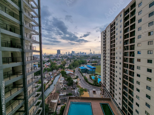 Colombo city skyline can be ssen beetween 02 apartment buildings in Borella, next to the P. Sarawanamutthu Cricket Stadium  photo