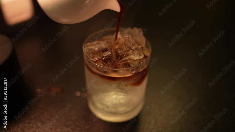 Preparation of an alcoholic cocktail in a night bar Preparation of an alcoholic cocktail in a night bar