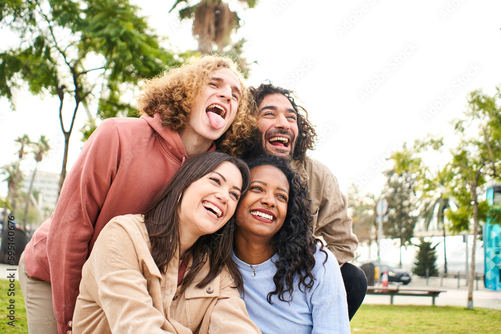 Fototapeta premium Happy friends from diverse cultures and races taking photo making funny faces - Youth, millennial generation and friendship concept. High quality photo