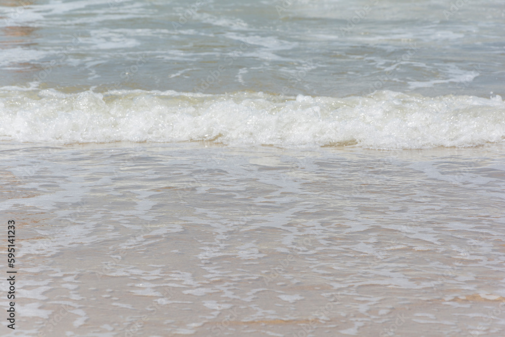 Waves breaking on the shore at the beach Waves breaking on the shore at the beach