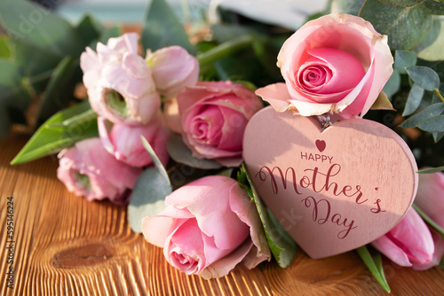 Mothers day card with pink spring flowers and heart shape on rustic wood Fototapet