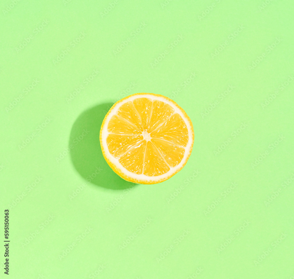 Lemon on a light green background. Minimal summer concept. Flat lay. Lemon on a light green background. Minimal summer concept. Flat lay.