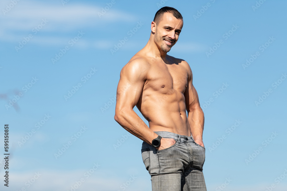 Serious Muscular Model Standing on Old Rooftop Serious Muscular Model Standing on Old Rooftop
