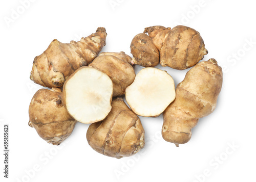 Whole and cut Jerusalem artichokes isolated on white, top view