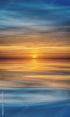 Golden sun rising over smooth, calm water © Cameo