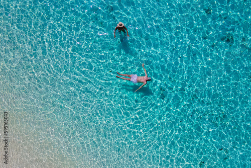 a couple swimming in the ocean of Koh Kradan Island in Thailand