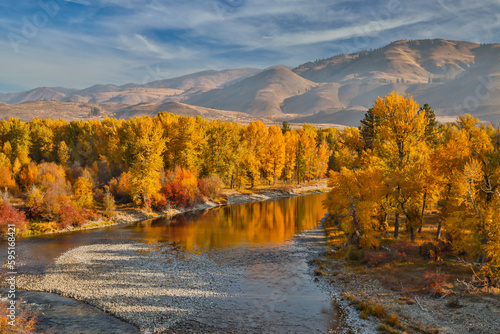 USA  Washington State  Methow Valley and river edged in Fall colored trees.