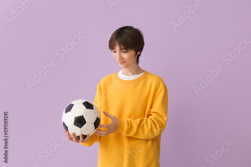 Teenage boy with soccer bal...