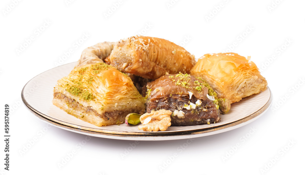 Plate with tasty baklava on white background