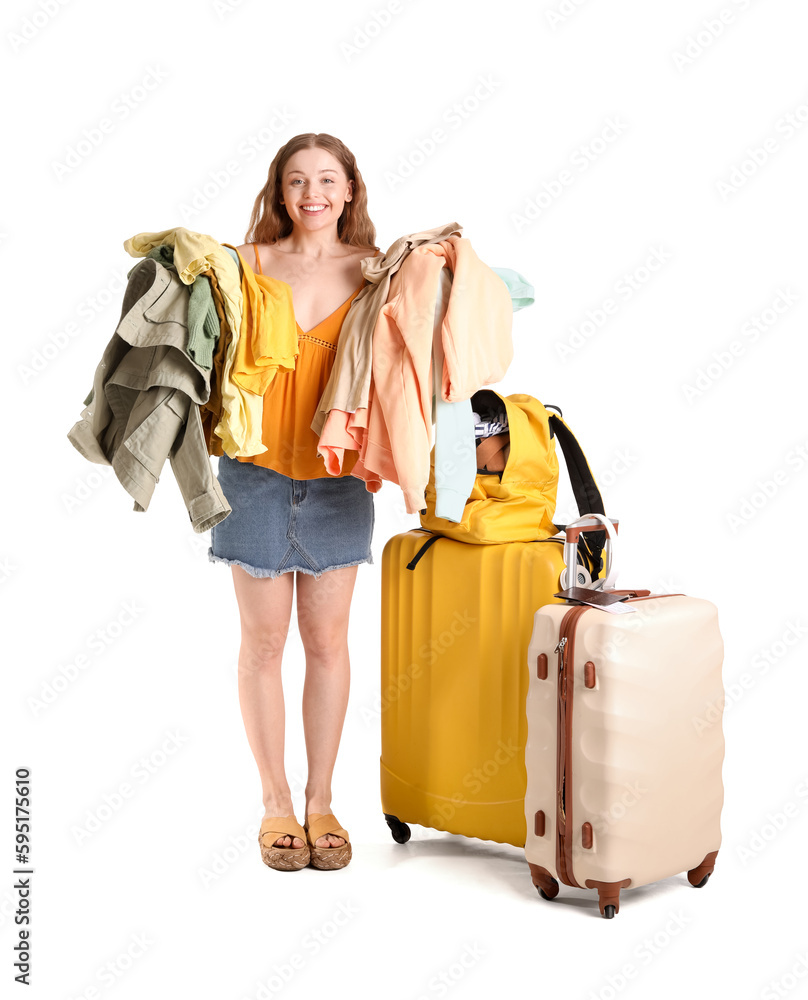 Young woman packing her clothes in backpack on white background Young woman packing her clothes in backpack on white background