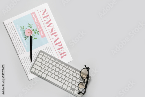 Newspaper with pen, compute...