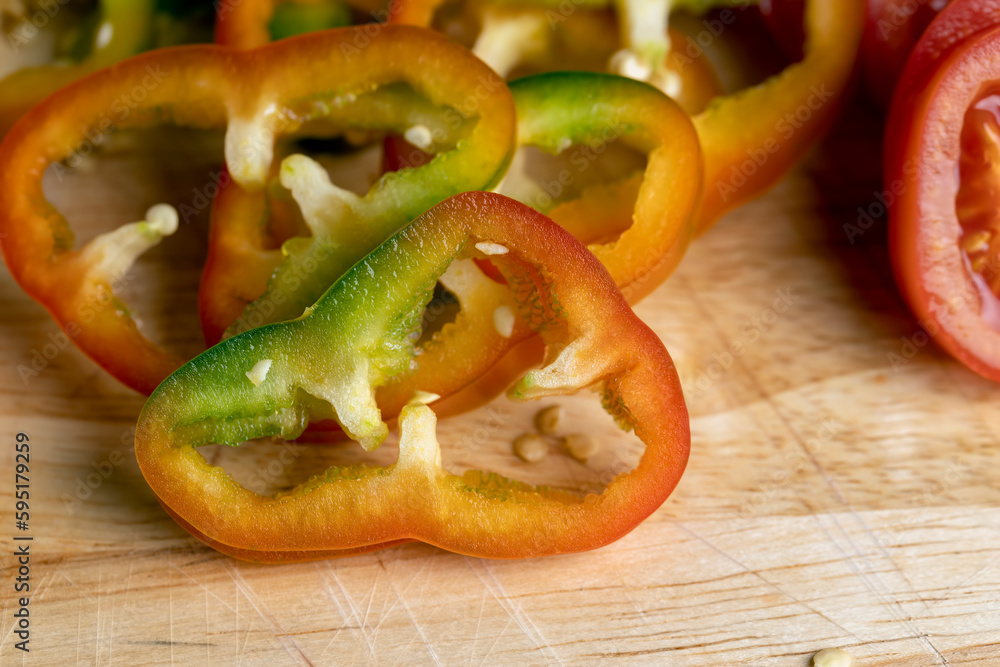 Fresh ripe bell pepper sliced on a board Fresh ripe bell pepper sliced on a board
