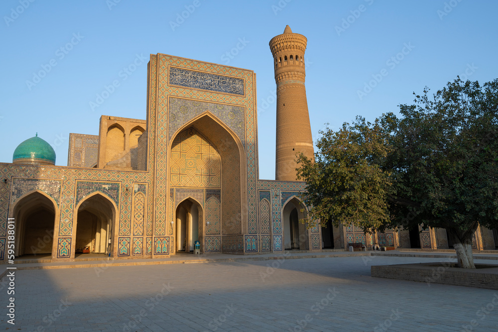 Warm sunny evening on the territory of the ancient Kalon madrasah, Bukhara