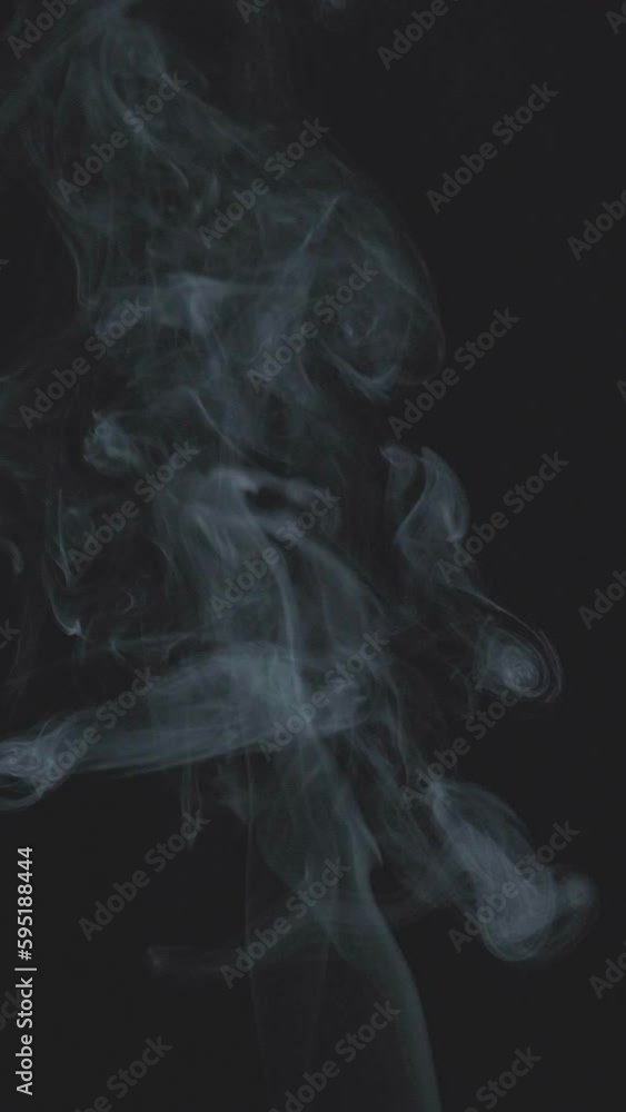 Slow motion vertical video of white smoke, fog, mist, vapor on a black background. Slow motion vertical video of white smoke, fog, mist, vapor on a black background.