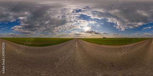 spherical 360 hdri panorama on old asphalt road with cracks with clouds and sun on evening blue sky in equirectangular seamless projection, as sky replacement in drone panoramas, game development