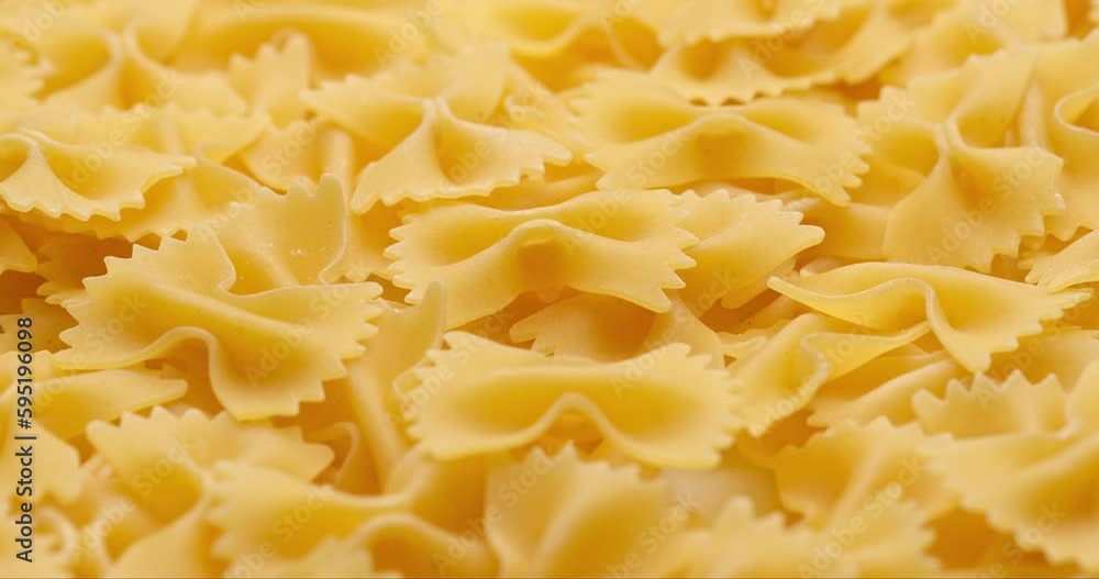 pasta backgroud - macro view of Dry Authentic Italian farfalle pasta backgroud - macro view of Dry Authentic Italian farfalle