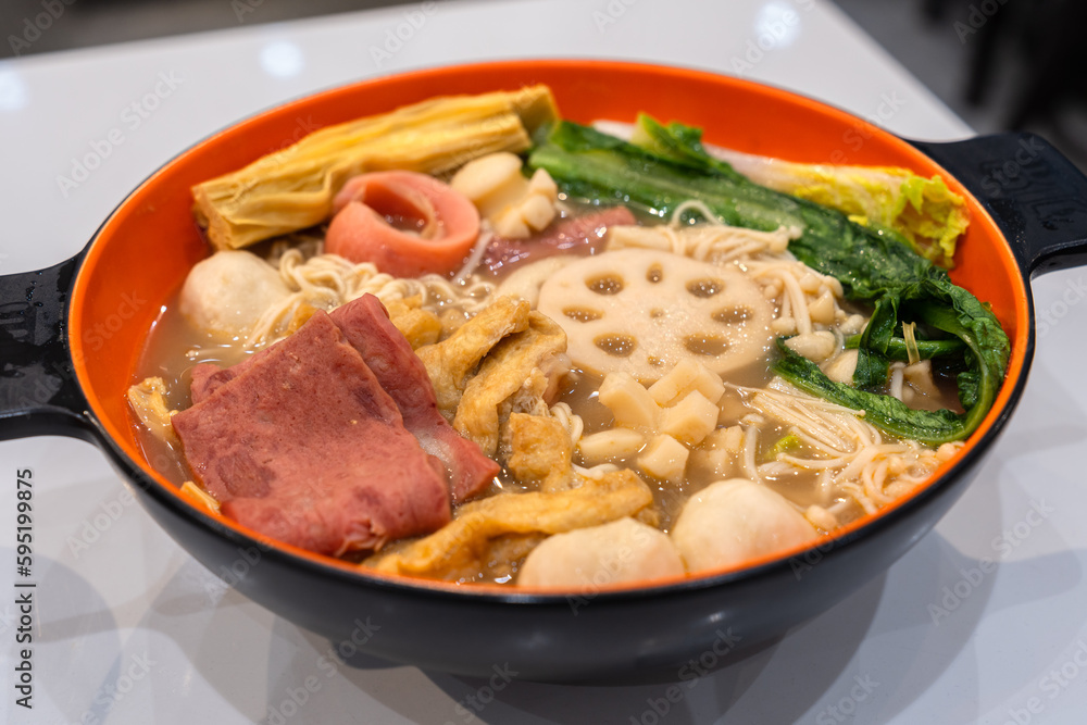 Improved version of spicy hot pot. A bowl of cooked assorted vegetables and meats. Chinese food.