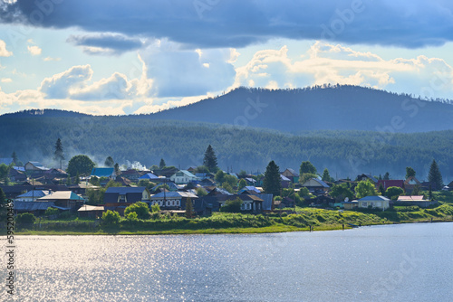 Panoramic view of the Tirlyansky village on the lake photo