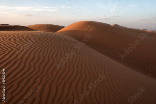 Sunset on ripples on Sand Dunes of Wahiba Sands Desert, Oman