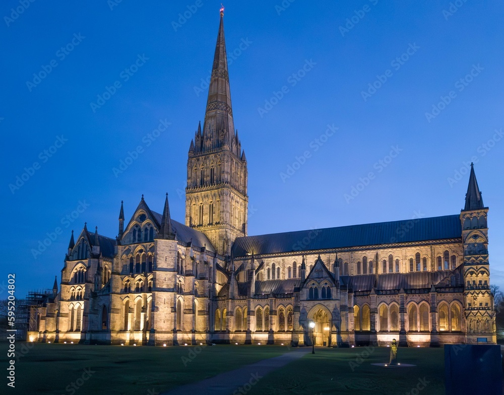 Spire of Salisbury Cathedral stands tall, Wiltshire, UK, England